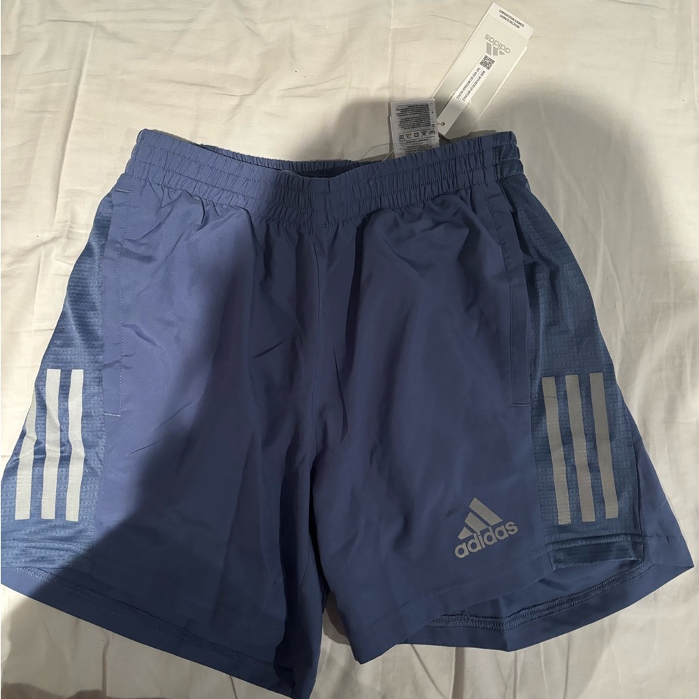 BLUE ADIDASS SHORTS  ATHLETIC AND FOR WORKING OUT . REFLECTIVE. SIZE SMALL